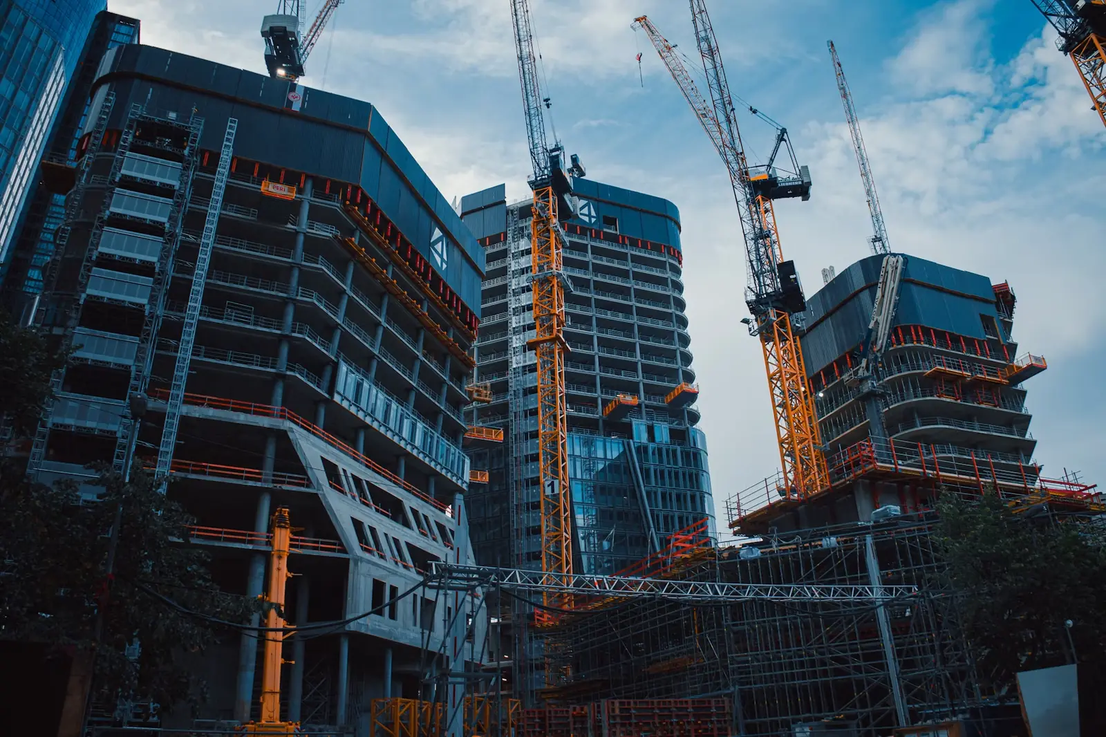 Skyscrapers under construction with tower cranes